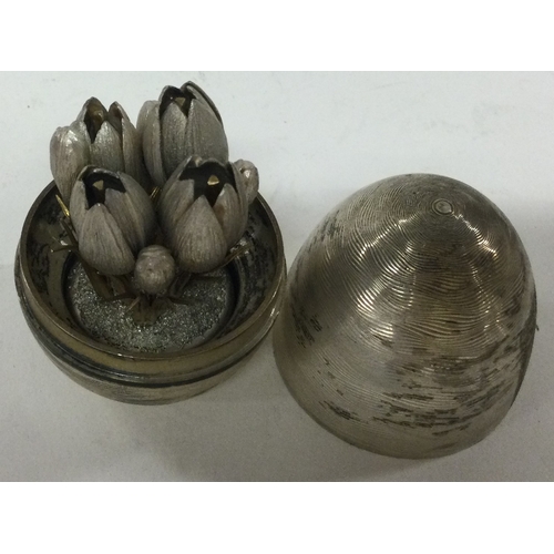 245 - A contemporary English silver 'Surprise' egg. Marked to base. Approx. 126 grams. Est. £140 - £160.