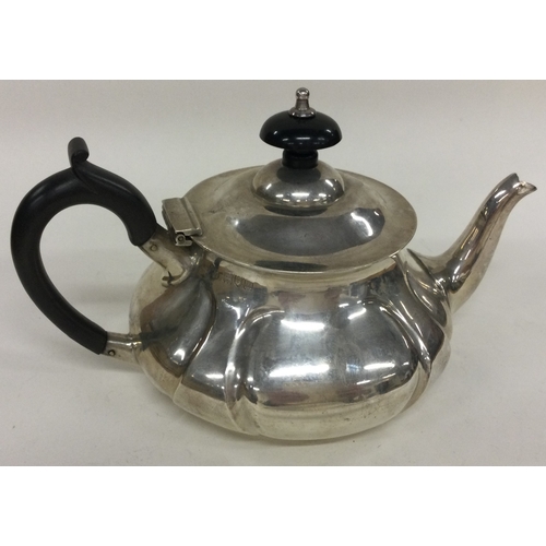 255 - A silver bachelor teapot of fluted design. London 1907. By Pearce & Sons. Approx. 275 grams. Est. £1... 