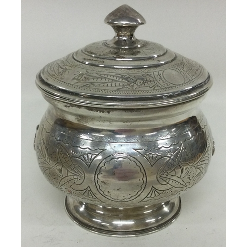 258 - A Russian silver biscuit box. Marked to base. Approx. 221 grams. Est. £200 - £300.