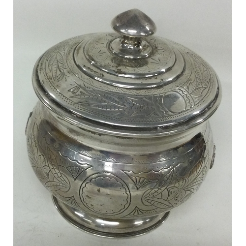 258 - A Russian silver biscuit box. Marked to base. Approx. 221 grams. Est. £200 - £300.