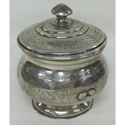 258 - A Russian silver biscuit box. Marked to base. Approx. 221 grams. Est. £200 - £300.