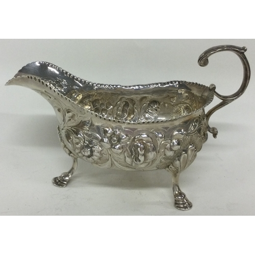 259 - An 18th Century chased silver sauce boat. London 1757. By William Sumner. Approx. 172 grams. Est. £1... 