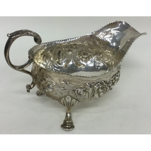 259 - An 18th Century chased silver sauce boat. London 1757. By William Sumner. Approx. 172 grams. Est. £1... 