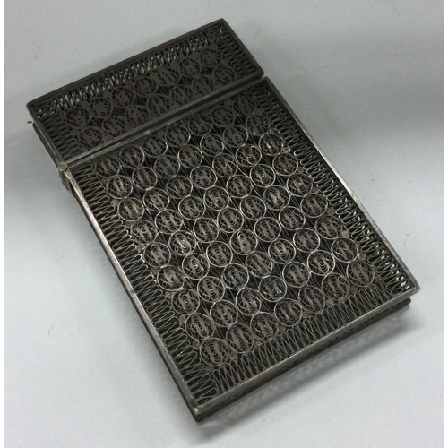 263 - A Continental silver filigree card case. Marked to interior. Approx. 51 grams. Est. £80 - £120.