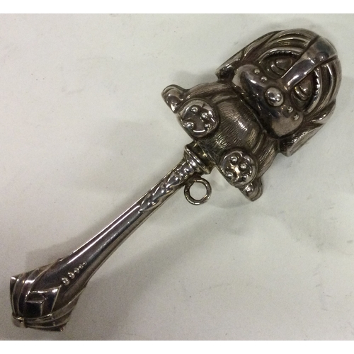 283 - A silver rattle in the form of a bear. Approx. 38  grams. Est. £30 - £50.