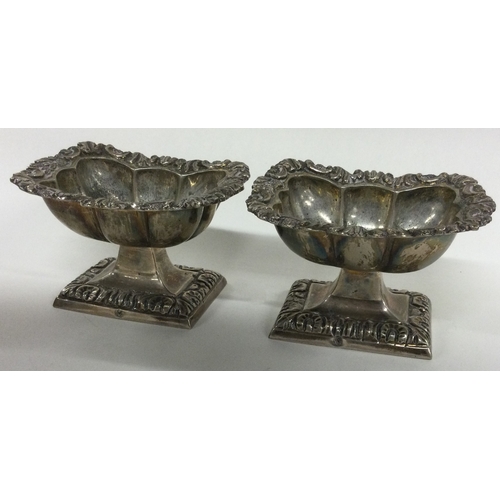 285 - A pair of early 19th Century silver salt cellars bearing control marks to rims. Approx. 217 grams. E... 