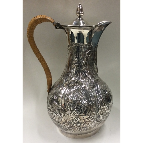 29 - A George III silver coffee jug with wicker covered handle. London 1784. By Wakelin & Taylor. Approx.... 