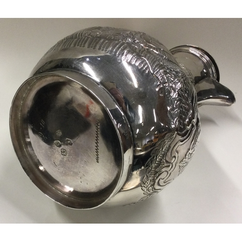 29 - A George III silver coffee jug with wicker covered handle. London 1784. By Wakelin & Taylor. Approx.... 