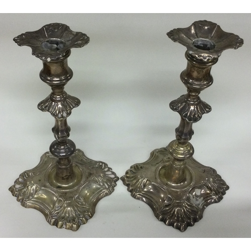 322 - A pair of 18th Century Georgian cast silver candlesticks. London 1764. By William Cafe. Approx. 20cm... 