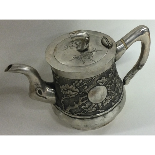 325 - A Chinese export silver teapot. Marked to base. Approx. 400 grams. Est. £300 - £500.