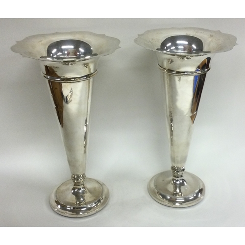 361 - A large pair of silver vases. Birmingham 1907. Approx. 527 grams of gross weight. Est. £120 - £150.