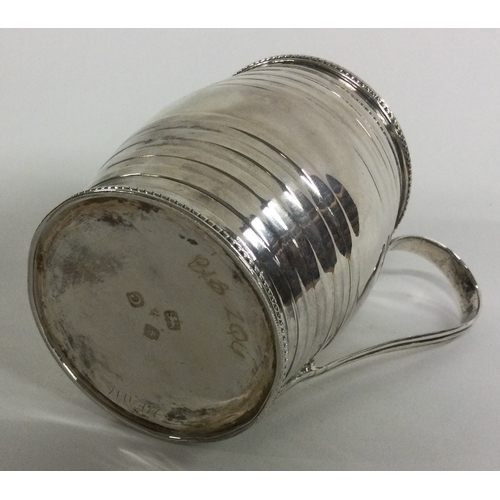 388 - A Georgian silver barrel shaped mug. London 1778. Approx. 105 grams. Est. £120 - £150.