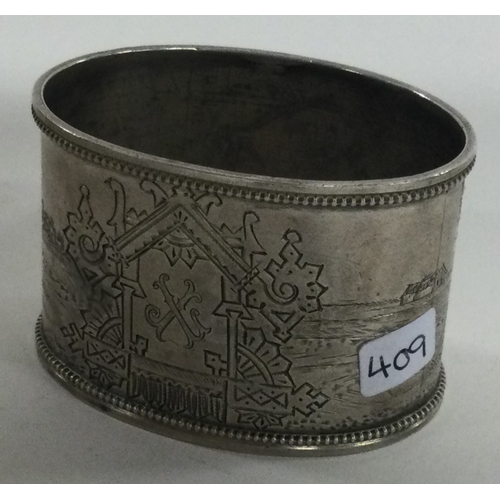 409 - A Russian silver napkin ring engraved with horses and carriages. Approx. 34 grams. Est. £30 - £50.