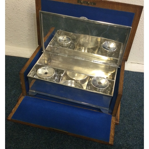 411 - A large silver combination cigar box with inkwells to centre in original box. London 1864. By Hunt &... 