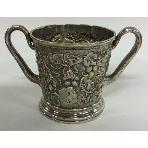 426 - A chased silver cup embossed with vines. Signed underneath by maker. London 1863. By Hunt & Roskell.... 