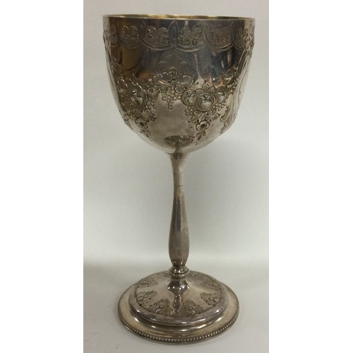 433 - A chased Victorian silver goblet. London 1869. By Martin Hall & Co. Approx. 124 grams. Est. £250 - £... 