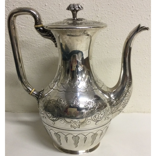 451 - A large Victorian silver coffee pot finely engraved. London 1846. By Joseph Angel. Approx. 876 grams... 