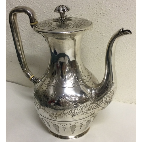 451 - A large Victorian silver coffee pot finely engraved. London 1846. By Joseph Angel. Approx. 876 grams... 