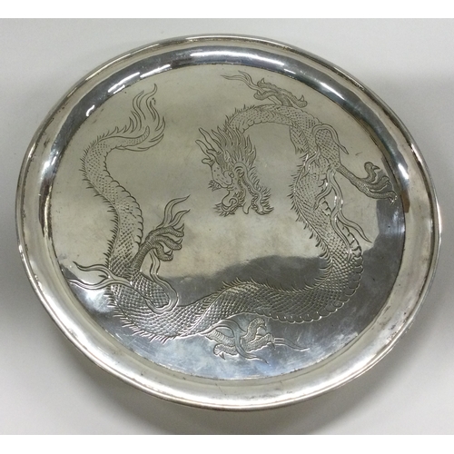 471 - WANG HING: A Chinese export silver salver engraved with dragons. Marked on feet. Approx. 215 grams. ... 