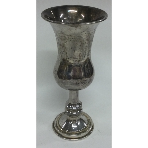 A large English silver Kiddush cup engraved with houses and flowers. Import marked. London 1901. App