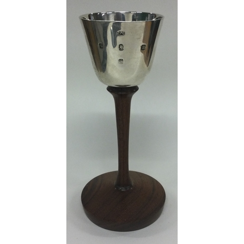 73 - GLASGOW: A fine contemporary Scottish silver goblet on wooden base. Maker's mark 'CFC'. Approx. 140 ... 