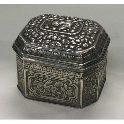 76 - A chased Turkish silver box with lift-off lid chased with animals. Approx. 68 grams. Est. £50 - £80.