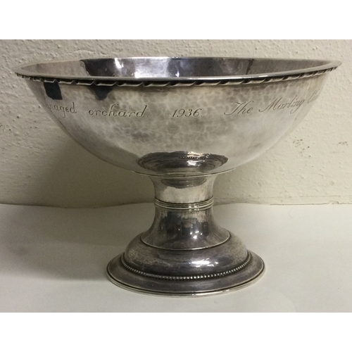 838 - An Arts & Crafts 20th Century silver presentation cup. Approx. 749 grams. Est. £600 - £800.