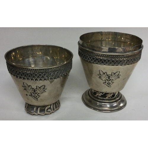 91 - A Judaica silver double beaker with pierced decoration and Hebrew script. Marked to base. Approx. 25... 