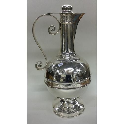 94 - A rare Victorian silver communion wine jug. Sheffield 1879. By Henry Wilkinson. Approx. 722 grams. E... 