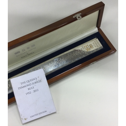 840 - A limited edition silver ruler in original case encrusted with diamonds to commemorate Elizabeth II.... 