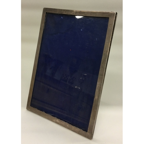 295 - A large silver photo frame. Birmingham 1914. Est. £80 - £120.