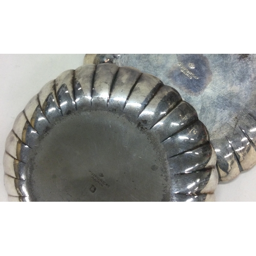 63 - PUIFORCART: A pair of French silver dishes of fluted design. Approx. 46 grams. Est. £80 - £120.