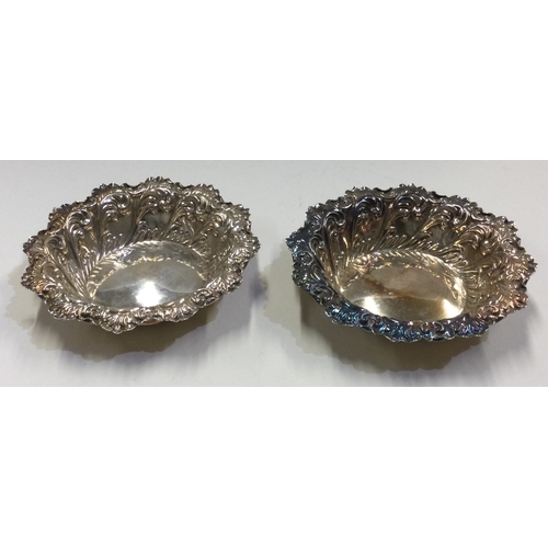 118 - A pair of chased Victorian silver dishes. Sheffield 1909. Approx. 27 grams. Est. £50 - £80.