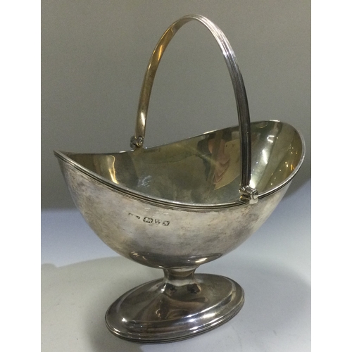 132 - CHESTER: A silver swing handled basket. 1913. Approx. 157 grams. Est. £100 - £150.