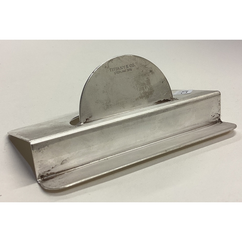 197 - TIFFANY & CO: A large silver United Airlines menu holder. Approx. 43 grams. Est. £40 - £60.