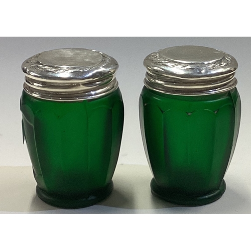 596 - A good pair of silver mounted green scent bottles. Est. £20 - £30.