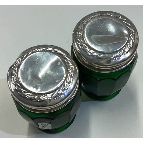 596 - A good pair of silver mounted green scent bottles. Est. £20 - £30.