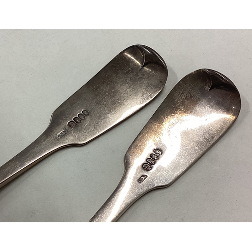 602 - DUBLIN: A good large pair of silver rat tail tablespoons. Approx. 159 grams. Est. £60 - £80.