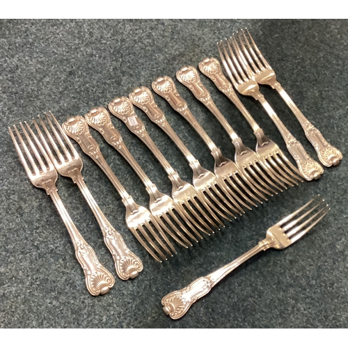 605 - A heavy set of twelve silver honeysuckle pattern table forks. London. By GA. Approx. 1218 grams. Est... 