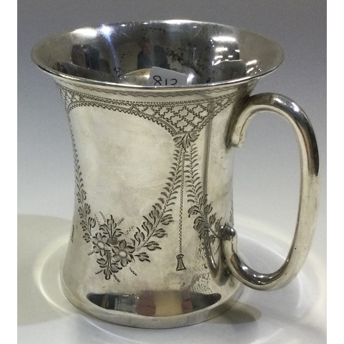 626 - A Victorian silver christening mug with swag decoration. London 1875. By William Eaton. Approx. 100 ... 