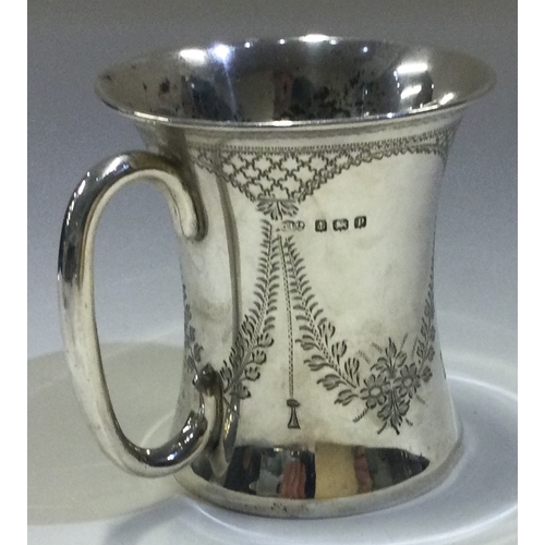 626 - A Victorian silver christening mug with swag decoration. London 1875. By William Eaton. Approx. 100 ... 