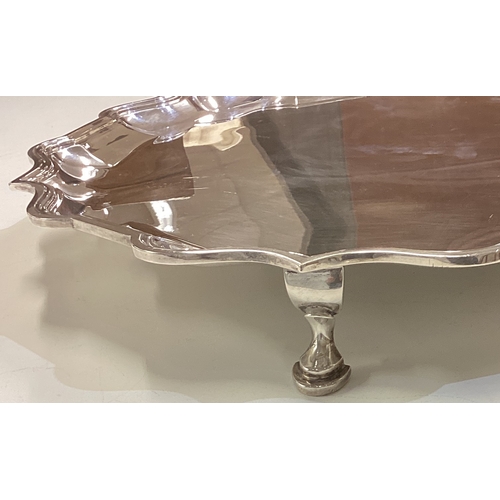 628 - A massive circular silver slaver on four spreading supports. London. By C&C. Approx. 1758 grams. Est... 