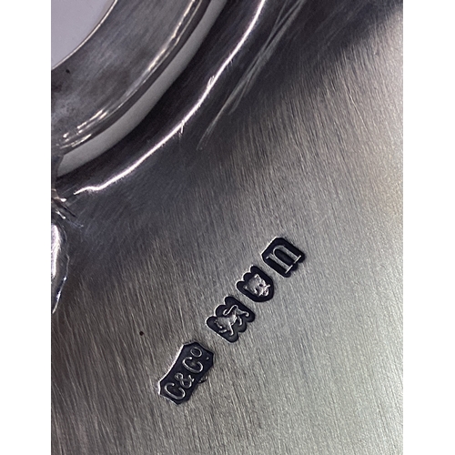 628 - A massive circular silver slaver on four spreading supports. London. By C&C. Approx. 1758 grams. Est... 