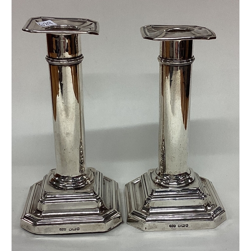 629 - A pair of shaped silver candlesticks. Sheffield. By JD&S. Approx. 497 grams of gross weight. Est. £4... 