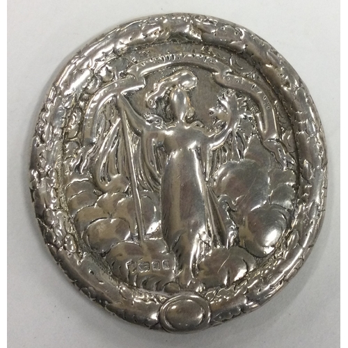 650 - A heavy Antique silver chased medallion. Approx. 123 grams. Est. £120 - £150.