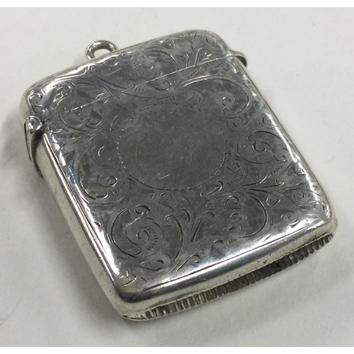 651 - A silver vesta case with engraved decoration. Birmingham 1899. Approx. 36 grams. Est. £20 - £30.