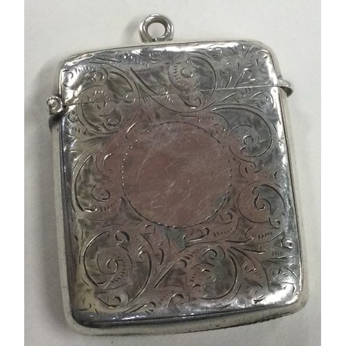 651 - A silver vesta case with engraved decoration. Birmingham 1899. Approx. 36 grams. Est. £20 - £30.