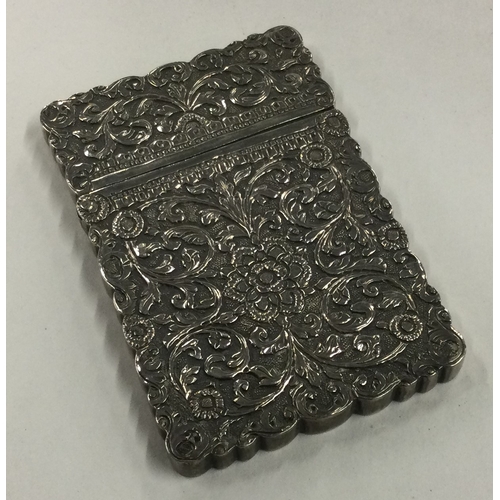 66 - A 19th Century Indian Kutch silver card case with chased decoration. Marked inside. Approx. 84 grams... 