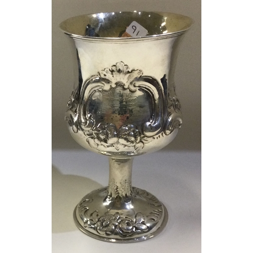 91 - A chased Victorian silver goblet embossed with flowers. London 1863. By Robert Hennell. Approx. 97 g... 