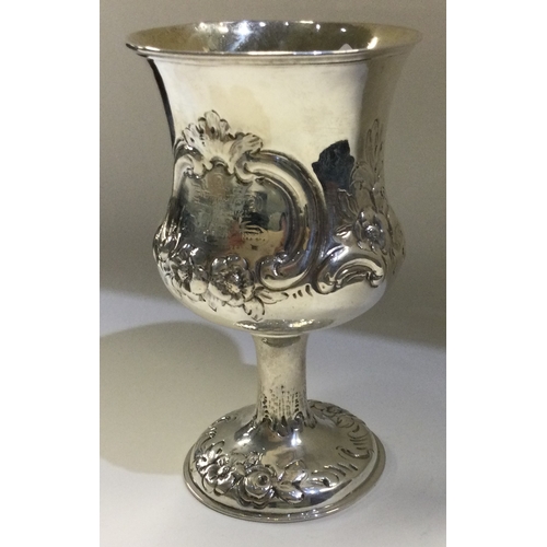 91 - A chased Victorian silver goblet embossed with flowers. London 1863. By Robert Hennell. Approx. 97 g... 